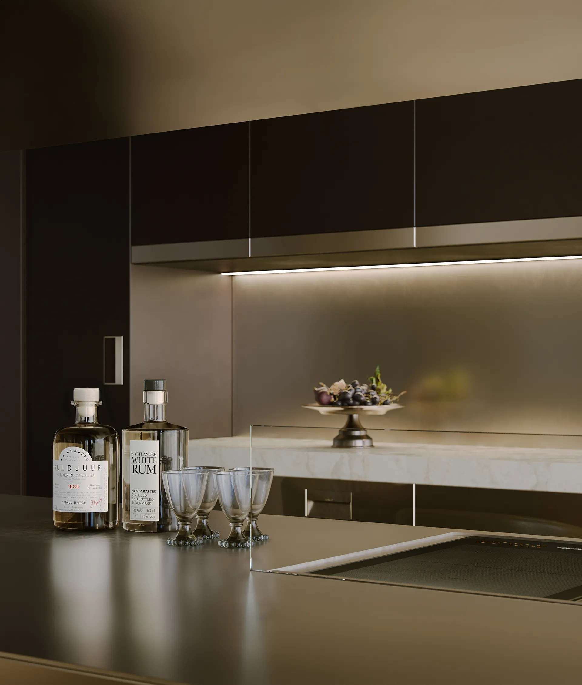 Cucina contemporanea di un attico DONO Sky Collection, con isola centrale, finiture ricercate e illuminazione integrata.